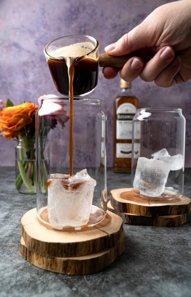 Pouring the espresso mixture on ice for Almande Baileys.