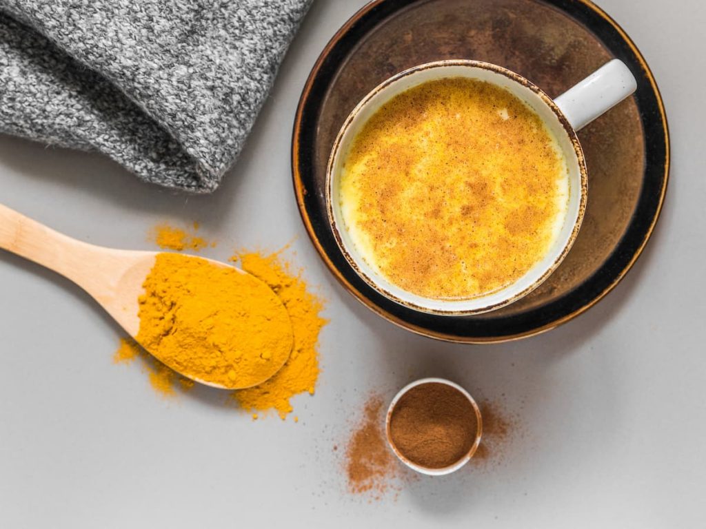 Turmeric latte with milk and cinnamon